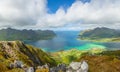 View from the top of Kleppstadheia mountain to the bay with turquoise water, and Rystad and Toe villages on the shores Austvagoya