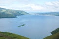 View from the top of Lake Toba hill with views of the hills and beautiful blue lake water Royalty Free Stock Photo