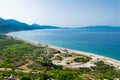 View from the top of the long sandy pebble Borsh beach. Albania. Greek Corfu or Kerkyra island at background. Ionian Sea Royalty Free Stock Photo