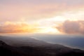 View from the top of the mountains in the early morning on the sea and mountains in a foggy haze. Royalty Free Stock Photo