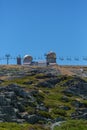 View at the top of the mountains of the Serra da Estrela natural park, tower buildings with dome and cable car railway circuit, Royalty Free Stock Photo