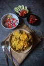 View from top of piece of boiled egg on chicken biryani or traditional rice along with potato