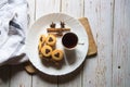 View from top of  pile of cookies along with a cup of coffee in a white plate Royalty Free Stock Photo