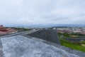 Shuri Castle rampart overlooking Okinawa skyline in Naha, Okinawa, Japan Royalty Free Stock Photo