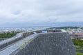 Shuri Castle rampart overlooking Okinawa skyline in Naha, Okinawa, Japan Royalty Free Stock Photo