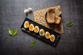 View from top of slices of boiled eggs and bread with use of selective focus