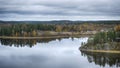 View from the top of the Snake Mountain on Lake Ladoga and a stone .Coast with a forest,