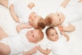 View from top of sweet babies laying in star shape Royalty Free Stock Photo