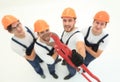 View from the top.the team of plumbers showing gas keys Royalty Free Stock Photo