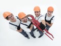 View from the top.the team of plumbers showing gas keys Royalty Free Stock Photo