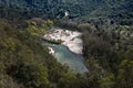 View from the top to the cascades in the jungle. River meandering through forested landscape. Panoramic view from above of Royalty Free Stock Photo