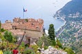 View from top to village buildings, tourists walking and sea Royalty Free Stock Photo