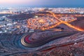 View from the top on wavy road in Muscat in blue hour