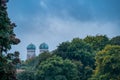 View at the tops of the both popular towers of the Frauenkirche in Munich, bavaria over green and autumn colored