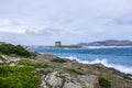 Aragonese tower on Stintino turquoise water and rocks, Sardinia, Italy. Royalty Free Stock Photo