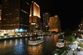 View of tour boats on the Chicago river, and the Riverwalk promenade below street level