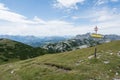 Tourist sign on mountain road, Alps Royalty Free Stock Photo