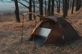 View of a tourist tent with a quick-build system, brown. no people. place for text. Dull dark tones of autumn morning, winter Royalty Free Stock Photo