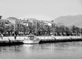 View of a touristic and historical city Nafplion,1st capital of Greece with traditional houses, palm trees and people walking o