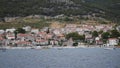 View of touristic place Bol on the island Brac in Croatia from a mooving boat