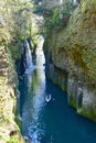Manai Falls and Tourists on Rowboats at Takachiho Gorge