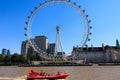 View of tourists sightseeing in a Thames Rockets boat before the London Eye on a sunny day Royalty Free Stock Photo