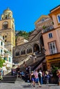 View of tourists on the streets of Amalfi, who stop to admire the cathedral Royalty Free Stock Photo