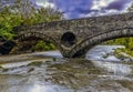 A view toward the bridge over the river Teifi at Cenarth, Wales after heavy rainfall Royalty Free Stock Photo