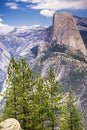 View towards Half Dome, snow capped mountains in the background, Yosemite National Park, California Royalty Free Stock Photo