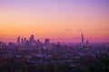 View towards London city skyline at sunrise from Hampstead Heath