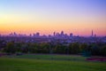 View towards London city skyline at sunrise from Hampstead Heath