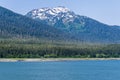 A view towards the wooded hills on the shoreline in the Gastineau Channel on the approach to Juneau, Alaska Royalty Free Stock Photo