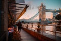 View of Tower Bridge and the city of London from the riverside restaurant at sunset or sunrise Royalty Free Stock Photo