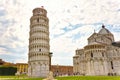 View of the Tower and the Duomo from Piazza dei Miracoli Pisa Tuscany Italy. The marble facade of Pisa Cathedral on the Piazza dei
