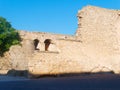 View of the tower and fragment of the city walls of Alghero. Sardinia, Italy.