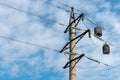 View of the tower of a high-voltage power line against the background of blue sky and clouds. Voltage power lines Royalty Free Stock Photo