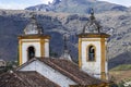 View of towers of historic baroque church Igreja Nossa Senhora das Merces e Perdoes, and mountains, Ouro Preto, Minas Gerais, Royalty Free Stock Photo