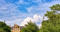 View of the towers of Schwerin Castle behind the trees. With blue sky and clouds in the background Royalty Free Stock Photo