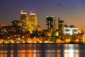 View of the towers, skyscrapers and buildings in Dnepr city at night, lights reflected on the river Dnieper, Ukraine. Royalty Free Stock Photo