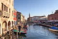 View of town Chioggia with canal Vena and church steeple of Chiesa della Santissima Trinita in Veneto, Italy