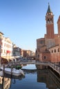 View of town Chioggia with canal Vena and church steeple of Chiesa della Santissima Trinita in Veneto, Italy