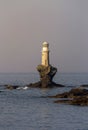 View of the town lighthouse Tourlitis and the sea Greece, island Andros, Cyclades