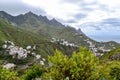 View of the town of Taganana in the north of Tenerife. Mountain green landscape with many small white houses on the ocean coast. Royalty Free Stock Photo