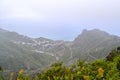 View of the town of Taganana in the north of Tenerife. Mountain green landscape with many small white houses on the ocean coast. Royalty Free Stock Photo