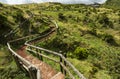 View of track with wooden fences over Fumaroles, Furnas de Enxofre, Terceira, Azores, Portugal.