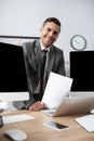 view of trader in grey jacket