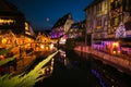 View of Traditional Alsatian half-timbered houses on the channel in Petite Venise, old town of Colmar, decorated and illuminated a