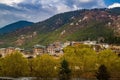 View of traditional bhutanese houses and white buddhist relogious sacred white flags in the capital of Bhutan, on backgrond of