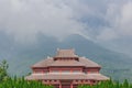 Traditional Chinese architecture in Chongsheng Temple against Cangshan Mountains covered in clouds in Dali, Yunnan, China