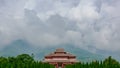 Traditional Chinese architecture in Chongsheng Temple against Cangshan Mountains covered in clouds in Dali, Yunnan, China